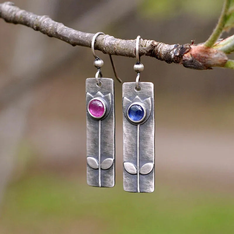 Red sapphire earrings with antique electroplated finish and geometric ellipse design