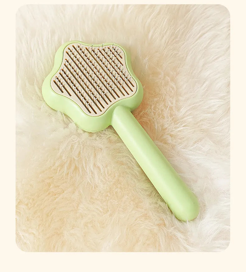 Self-cleaning stainless steel needle cat comb with magic wand handle in green or yellow