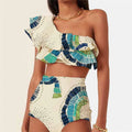 White women's one-shoulder swimsuit with a large decorative lotus leaf layer on the front.