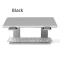 Black aluminium alloy foldable laptop stand with adjustable tilt on desktop