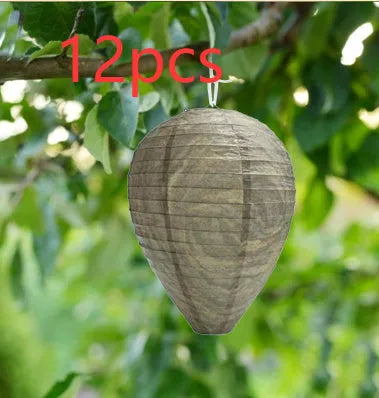 A rectangular photo colour beehive lantern with a honeycomb paper structure and wire frame.