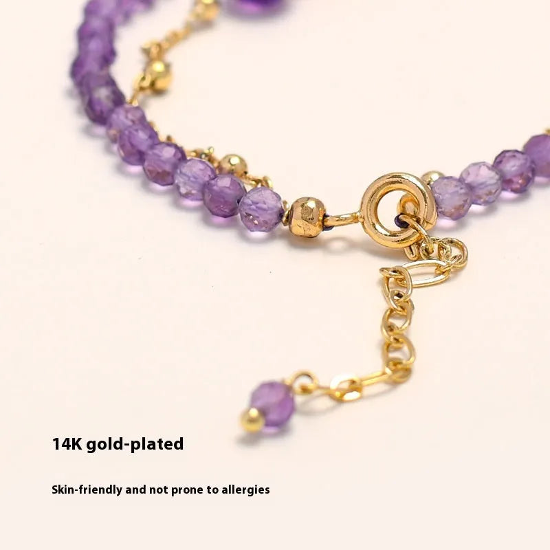 Women's amethyst bracelet with electroplated crystal stones in a diamond Chinese pattern.