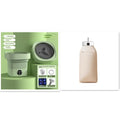 White cylindrical portable laundry drier with remote control on flat surface