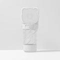 Green 3-in-1 portable pet water bottle with food container and waste bag dispenser for dogs and cats