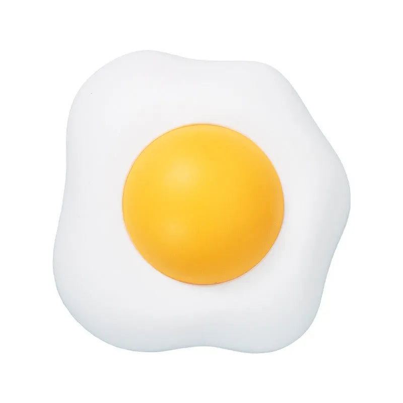 Interactive catnip ball toy stuck to wall with cat playing, showing fried egg and poached egg shape options