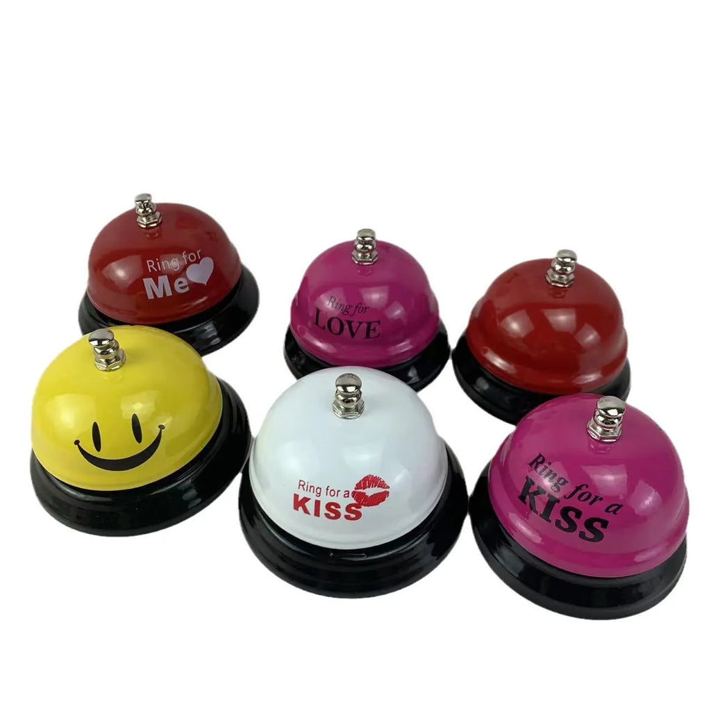 Iron hand bell with handle in one of eleven available colours, including red, green, blue, and pink.