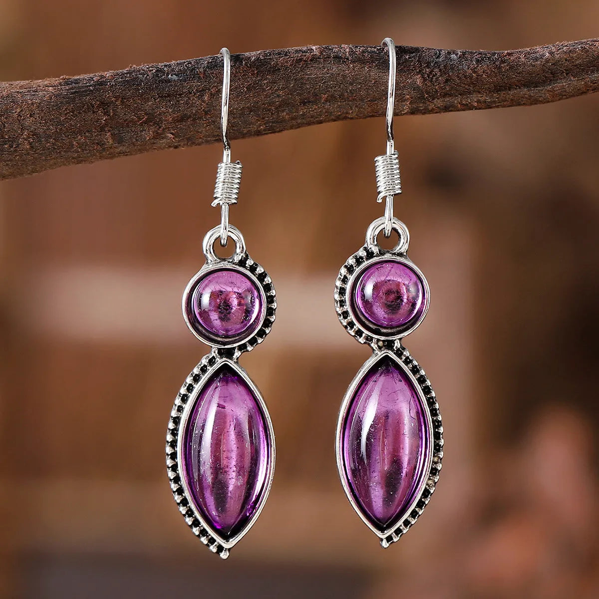 Geometric vintage earrings with black and purple gemstone accents in bohemian style