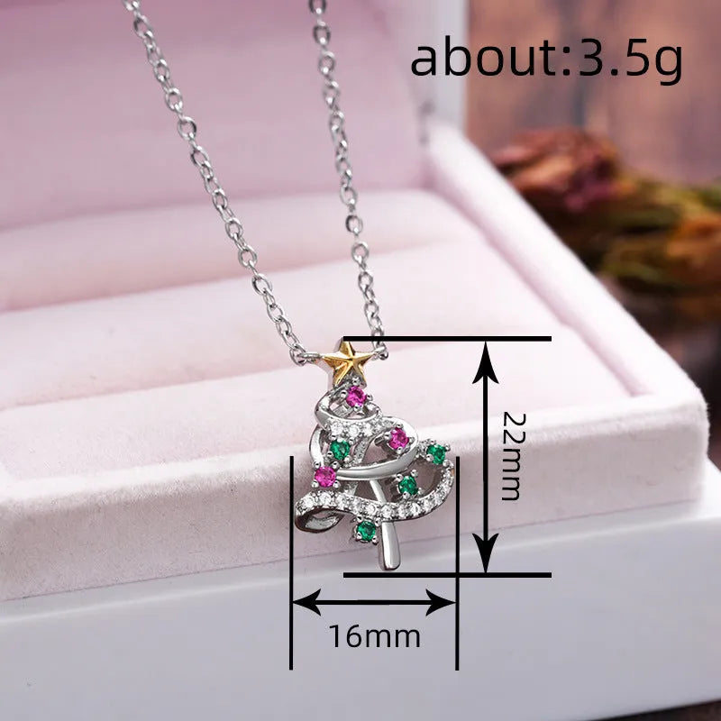 Two-tone copper Christmas tree necklace with inlaid zircon and adjustable O-ring chain on white background