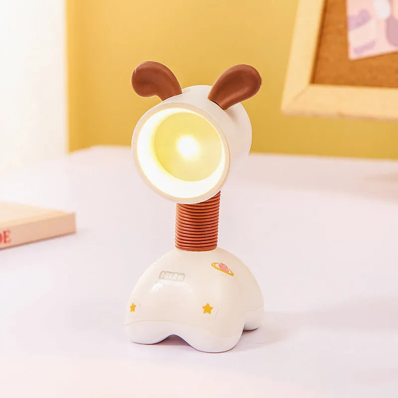 DIY cartoon magnetic small night lamp in assorted animal styles and colours on a desktop.