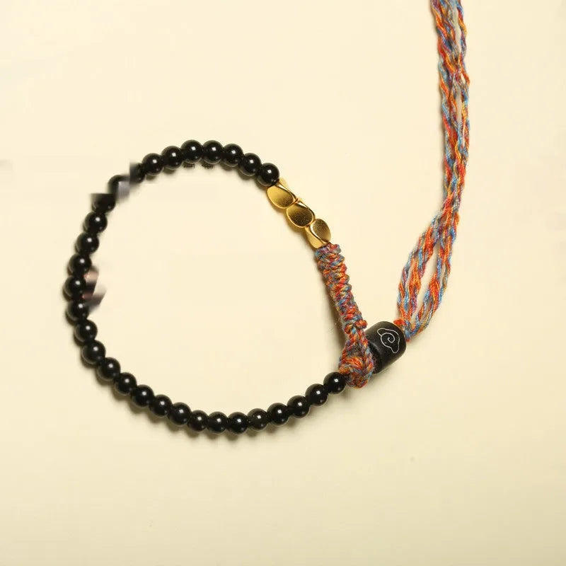 Hand-woven obsidian carrying strap showing 4mm width and textured surface