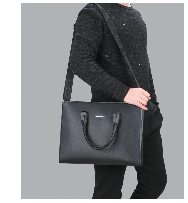 One-shoulder cross-slung male business briefcase in blue with stitching detail and soft handle