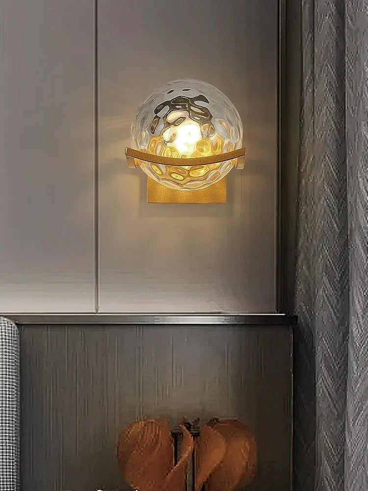 European wall lamp with black base and milky white cover, mounted on bedroom wall