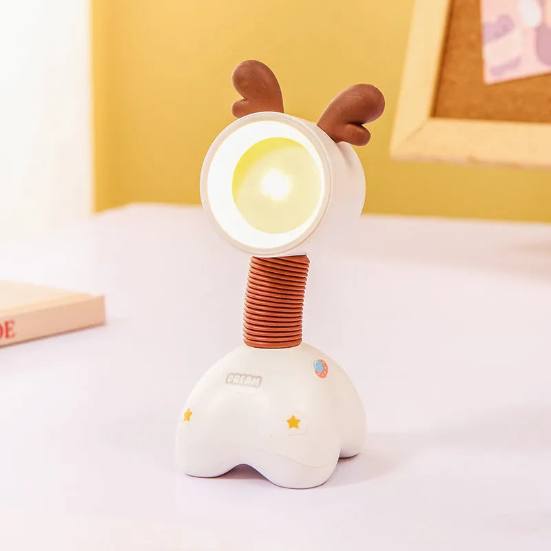 DIY cartoon magnetic small night lamp in assorted animal styles and colours on a desktop.