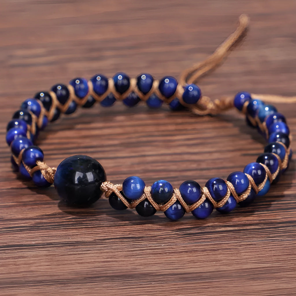 Handmade woven geometric pull bracelet with blue tigereye stone beads.