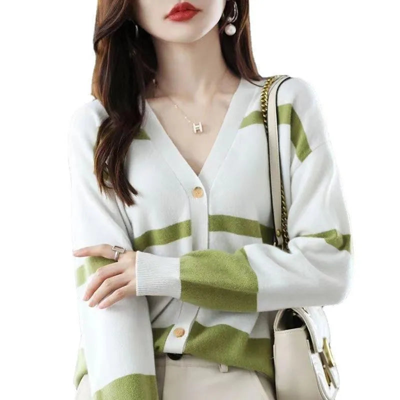 Women's black and white striped V-neck knitted cardigan with 3D pattern and buttons.