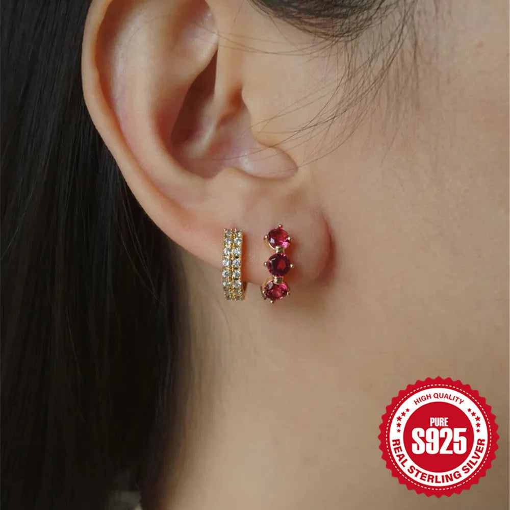 S925 sterling silver geometric sunflower stud earrings with golden zircon detail.