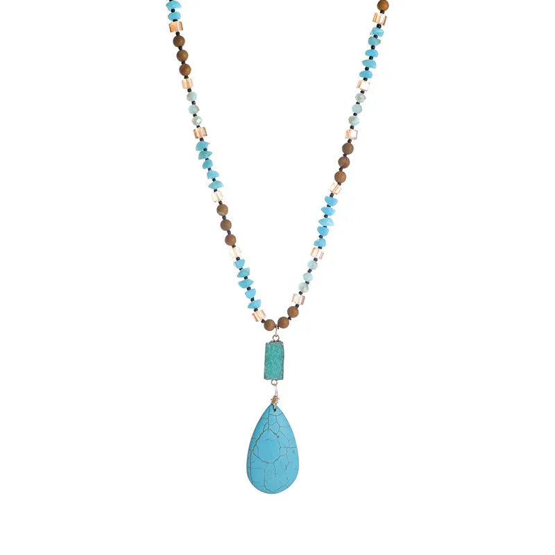 Turquoise blue necklace with water drop shaped pendant on ball bead chain