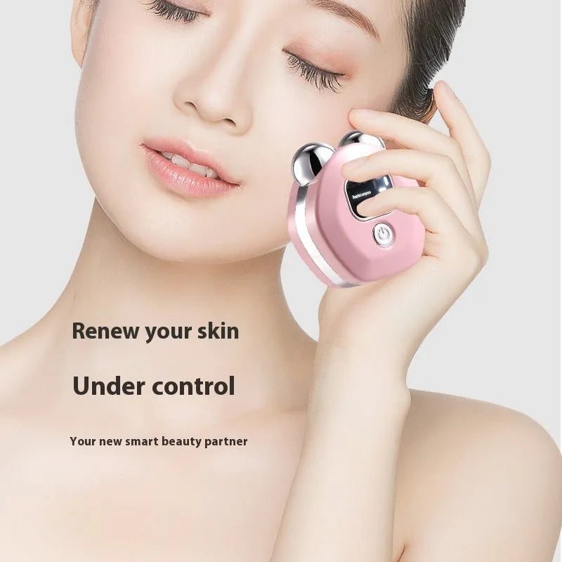 Portable micro current double-roller facial massage instrument with hot compress function in light blue