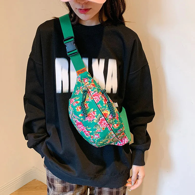 Women's floral Western style waist bag with three-dimensional pocket in black, red, green or blue colour options