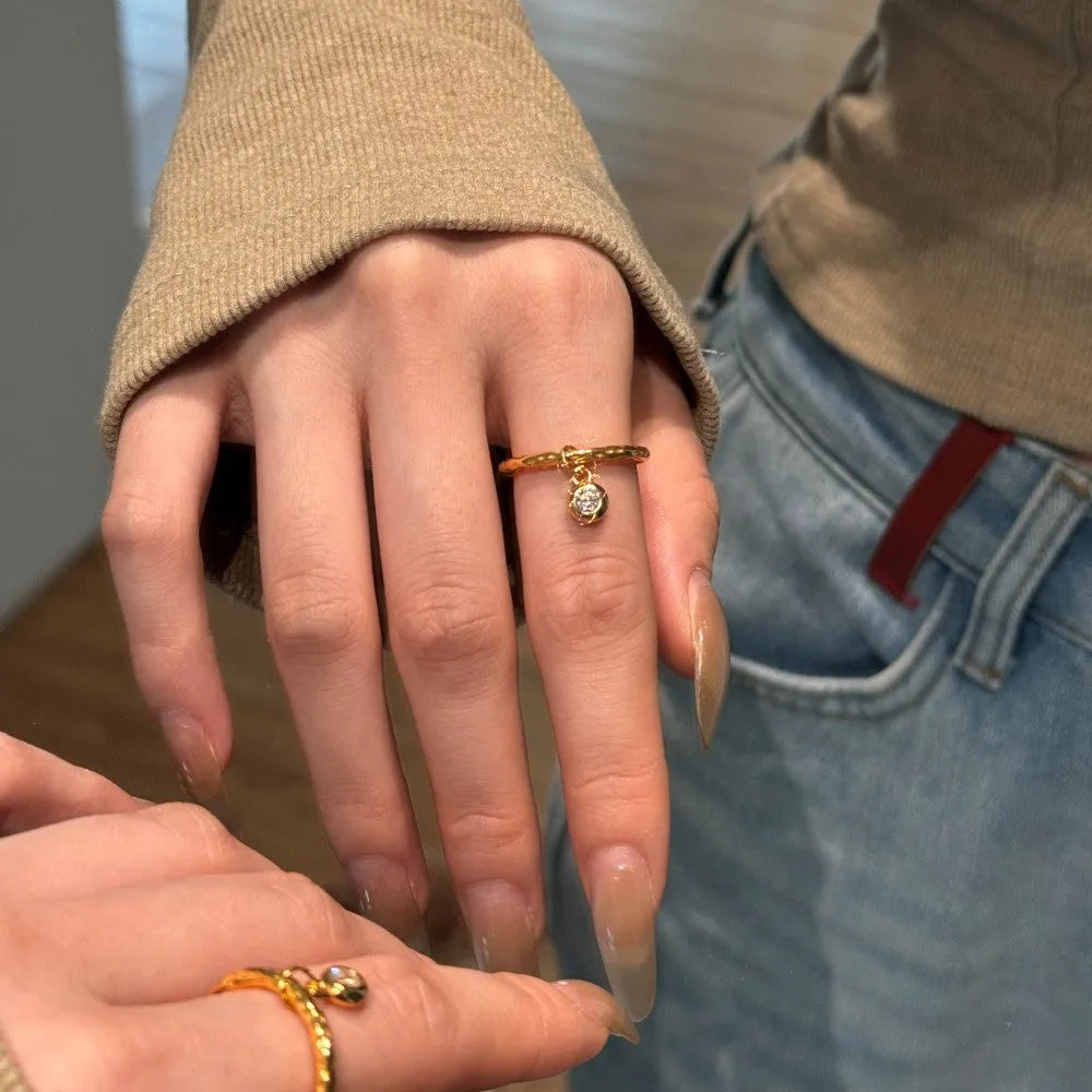Women's silver ring with pleated texture in electroplated gold finish, available in sizes No 6 to No 8