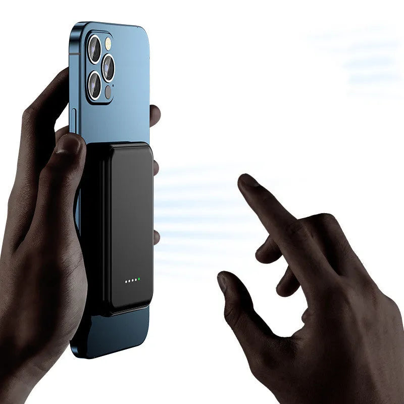 Mini magnetic wireless power bank 5000mAh with LED display and AI cooling in cool black colour on a table