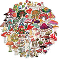 50 cartoon PVC waterproof stickers in assorted graffiti styles including astronaut, drink, and animal designs on a white background