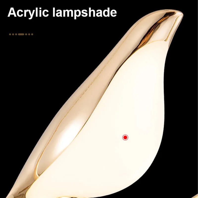 Modern minimalist magpie bird silhouette LED chandelier ceiling light made from zinc alloy and acrylic.