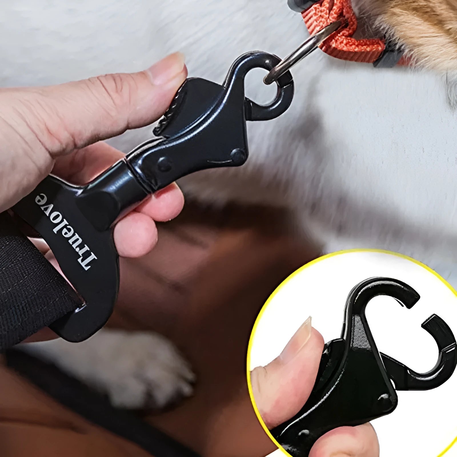 Black aluminium alloy pet car safety buckle with clip on a car seat belt
