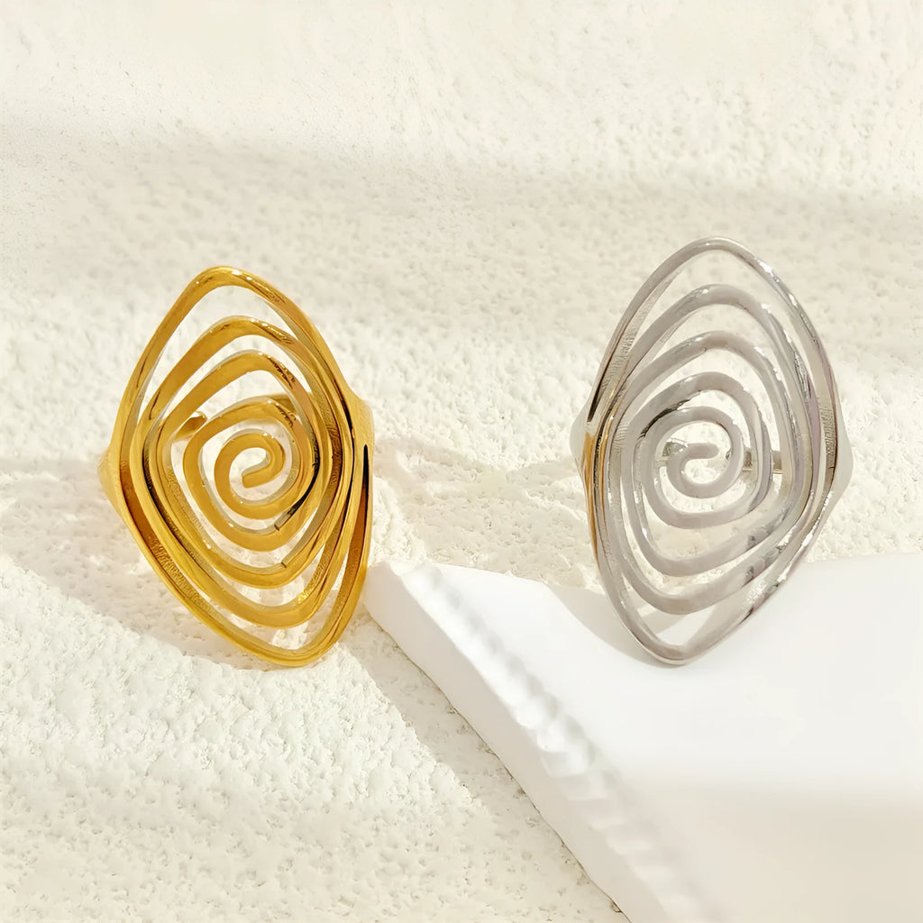 Stainless steel exaggerated circle geometric ring in gold colour, adjustable opening, front view.