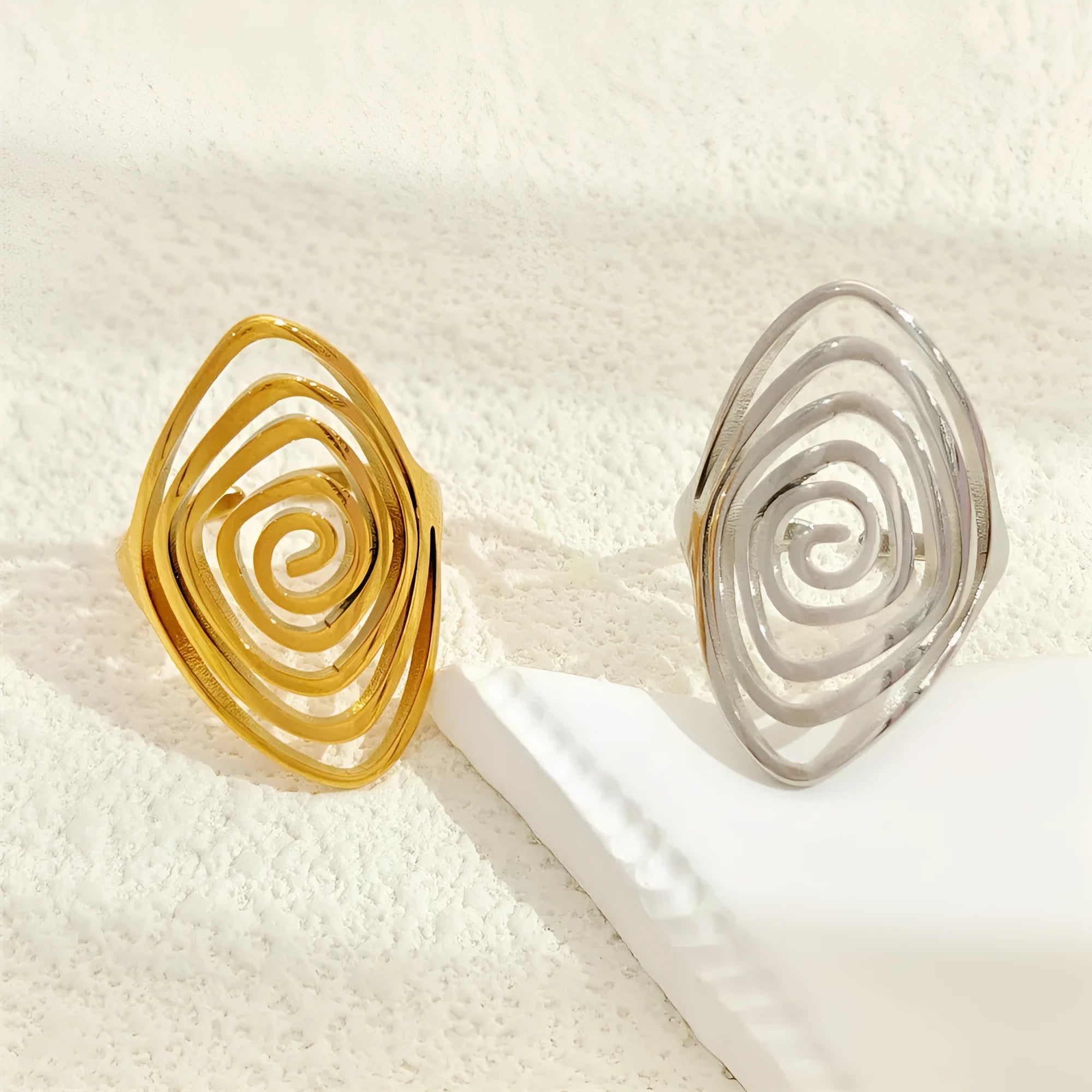 Stainless steel exaggerated circle geometric ring in gold colour, adjustable opening, front view.