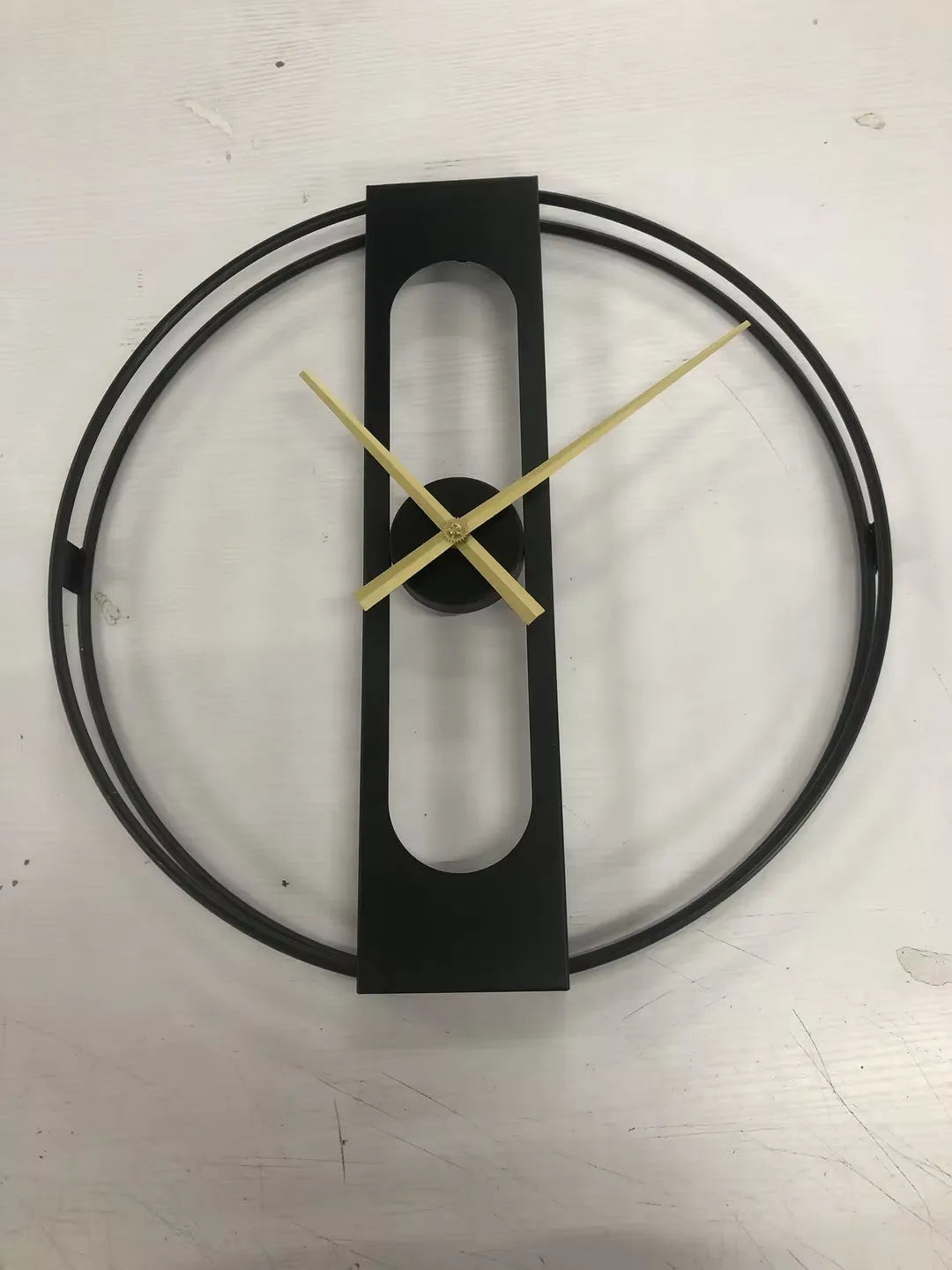 50cm round metal wall clock in black or gold colour with battery-powered movement