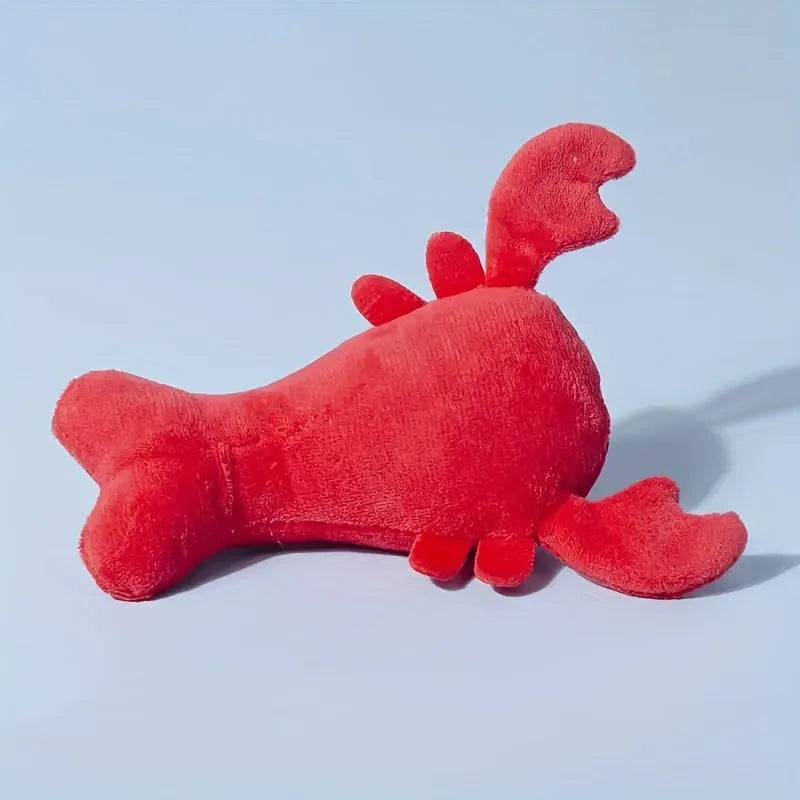 Red crab lobster squeaky stuffed chew toy for small and medium-sized dogs on a white background.