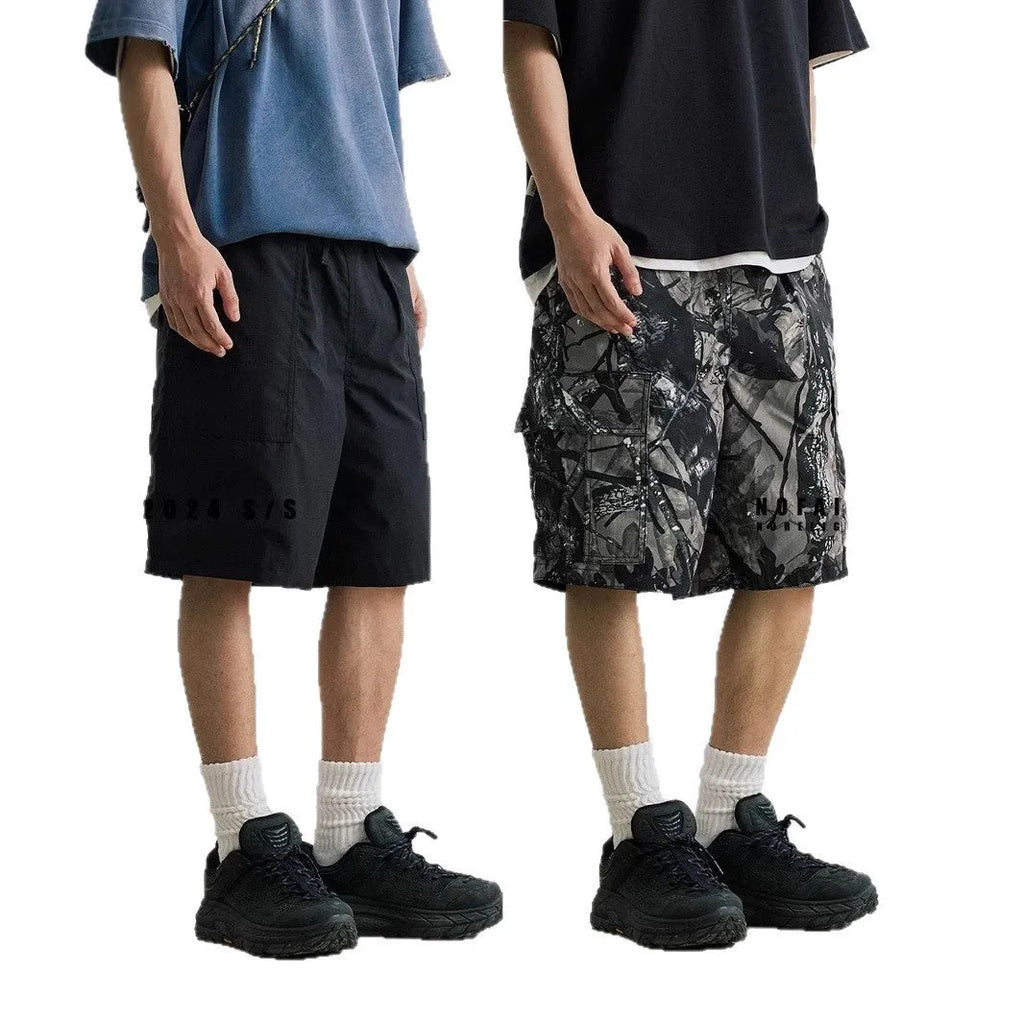 Loose straight-leg casual denim shorts in black or army green with a mid waist and zip fly.