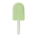 Soft silicone foldable pet hair brush in green, blue and yellow, used for grooming cats and dogs