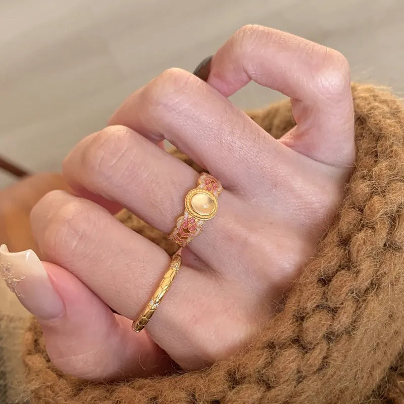 Pink crystal enamel geometric open ring on gold-plated copper band for women.