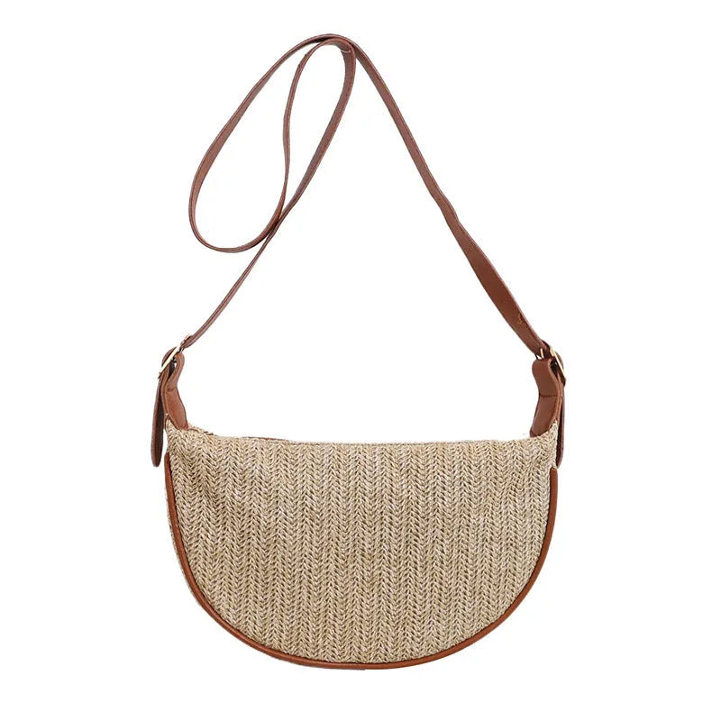 Women's knitted straw woven crossbody bag showing internal phone and file compartments