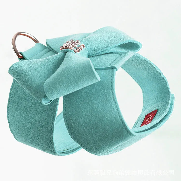A soft microfiber dog chest strap with a decorative bowknot, shown in pink, blue, and orange colour options.