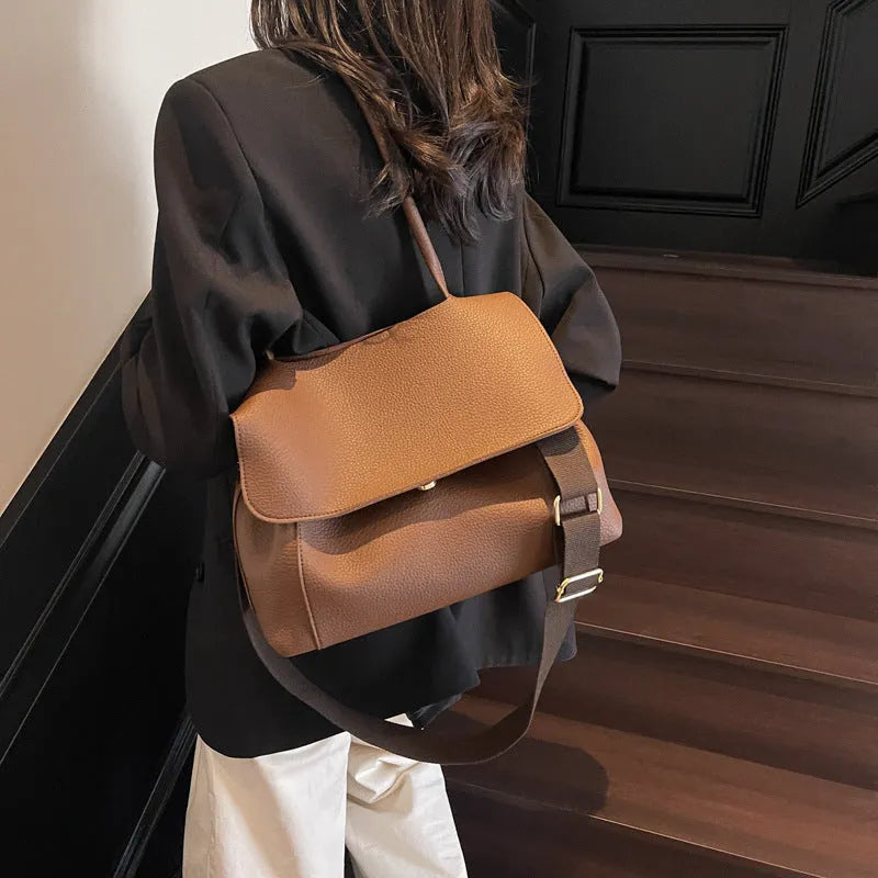 PU leather tote bag with a horizontal square shape and double shoulder straps in a neutral colour