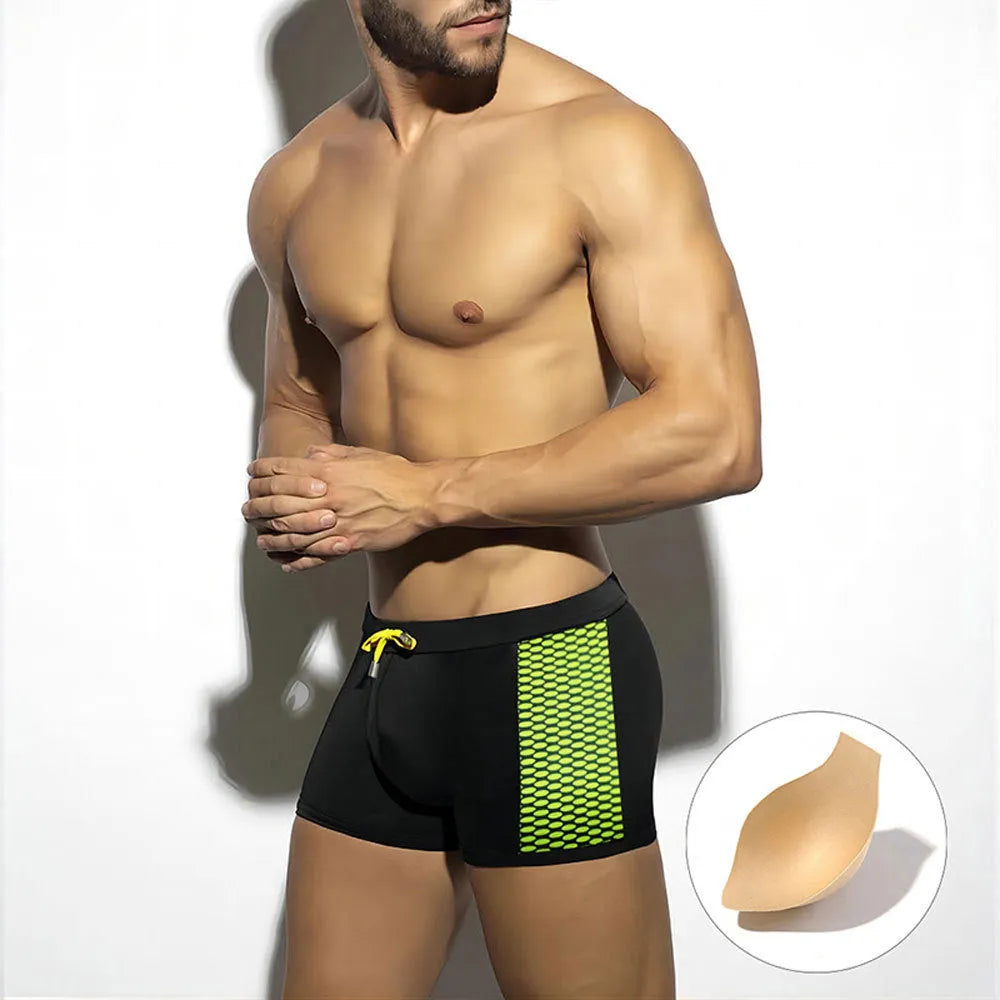 Men's polka dot print swimming boxers in quick-dry nylon fabric on a size chart.
