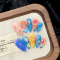 Three-dimensional carved jellyfish plastic wearable armour set in 672 almond nail colour with marine floral patterns.