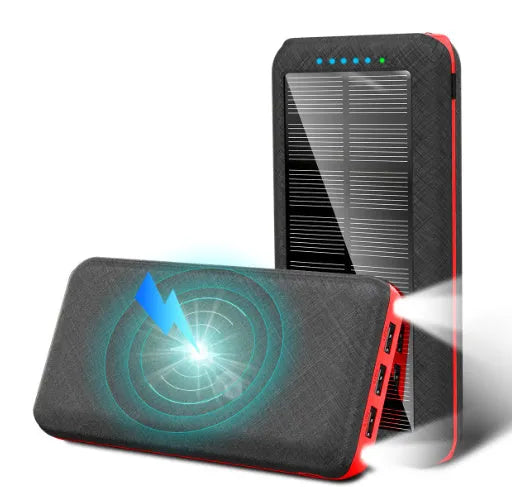 Black wireless power bank with Qi charging pad, three USB ports, and LED flashlight showing capacity display.