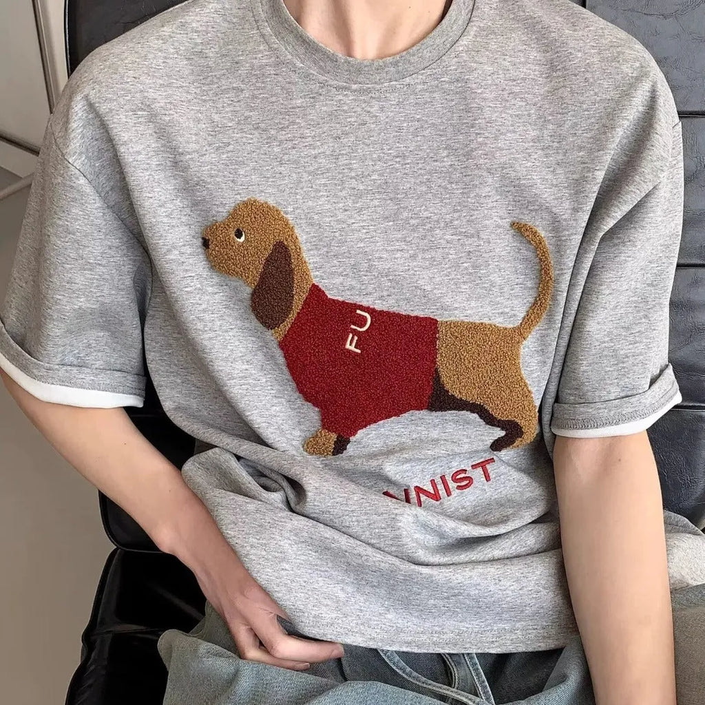 Men's grey short sleeve cotton T-shirt with an embroidered sausage dog towel design on the front.