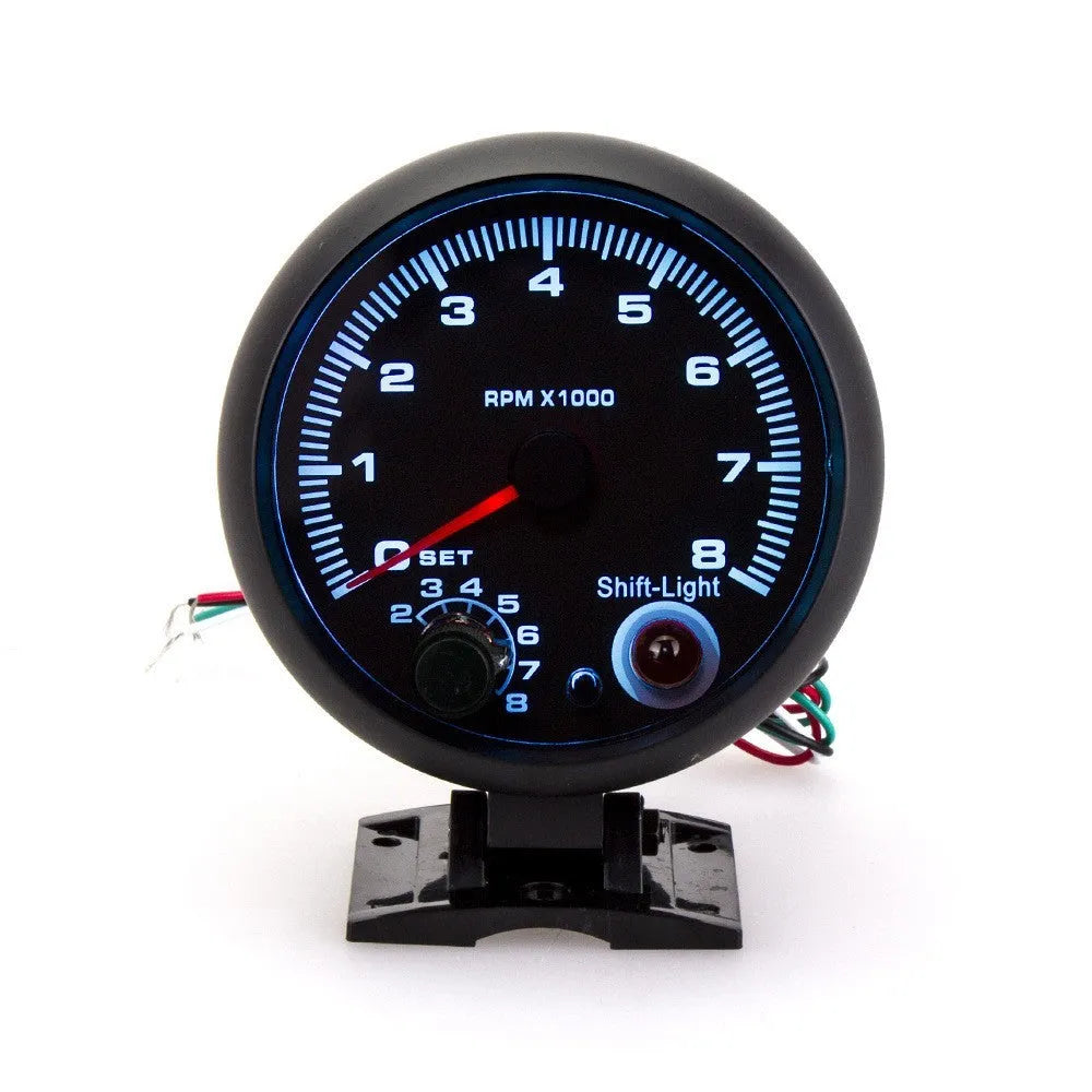 Blue light pointer automotive tachometer showing 0-8000 RPM range