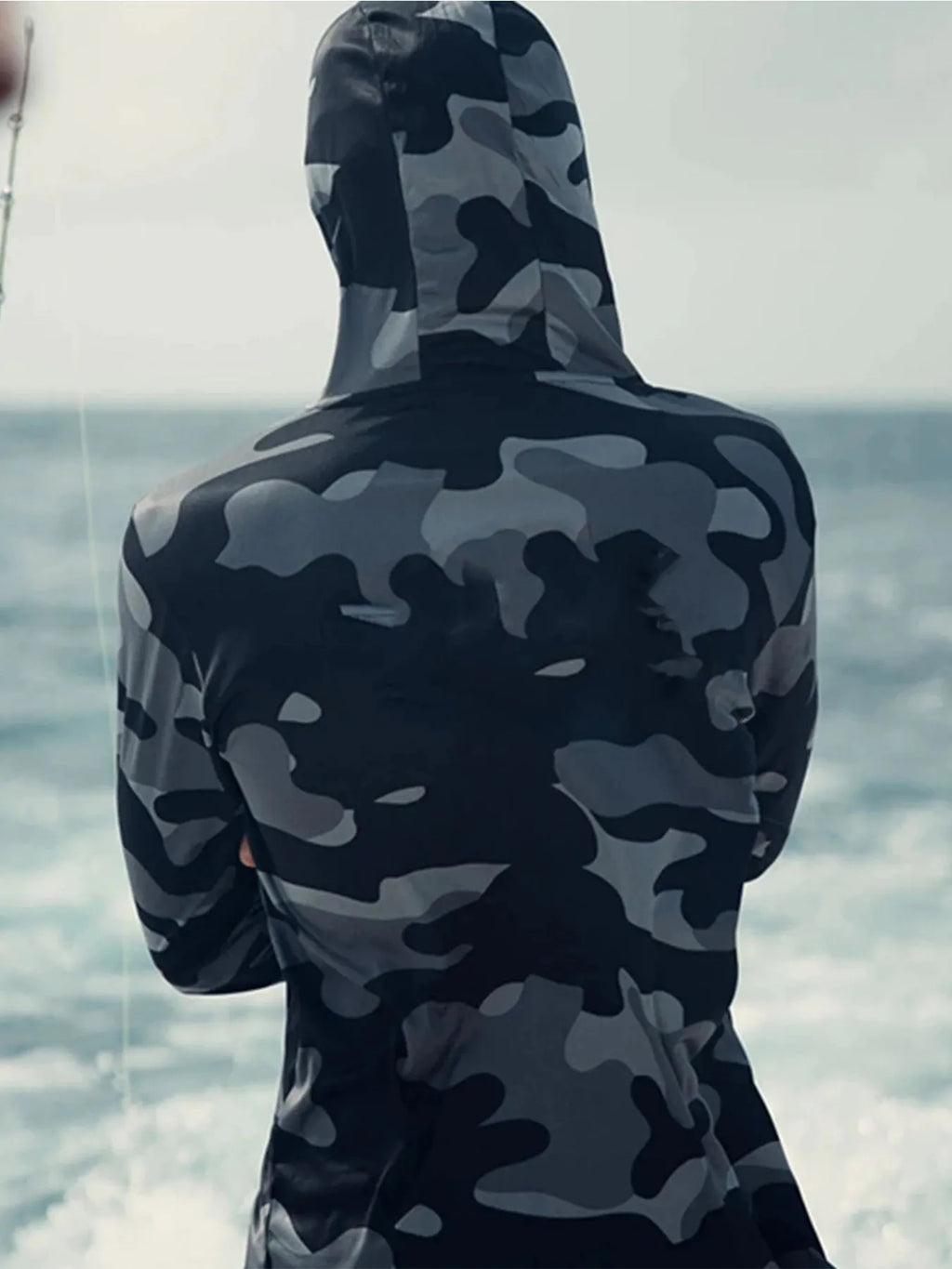 Huk Pursuit grey long sleeve fishing shirt with mesh side panels and crew neck.
