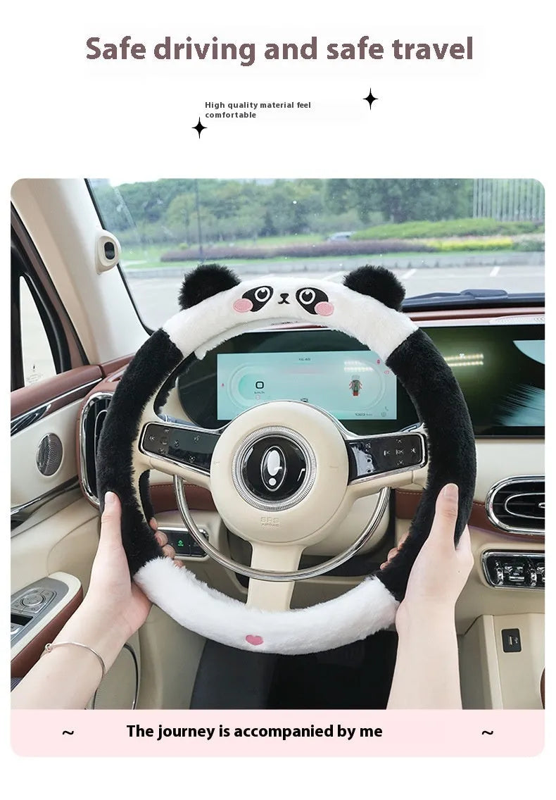 Plush rabbit fur steering wheel cover with embroidered cartoon design, shown fitted on a 38cm wheel.