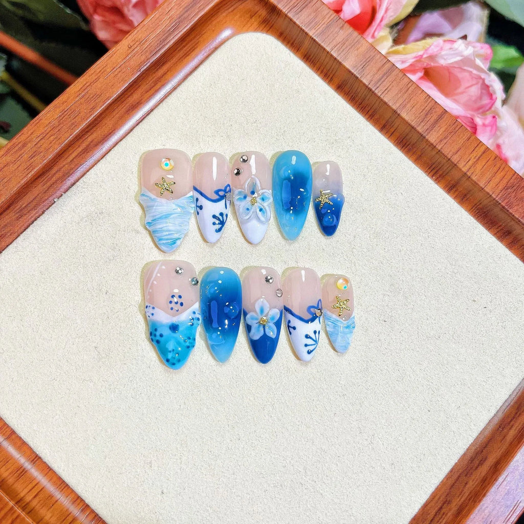 Blue hand-painted carved summer ice transparent plastic fake nails showing carved texture and transparent quality