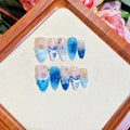 Blue hand-painted carved summer ice transparent plastic fake nails showing carved texture and transparent quality