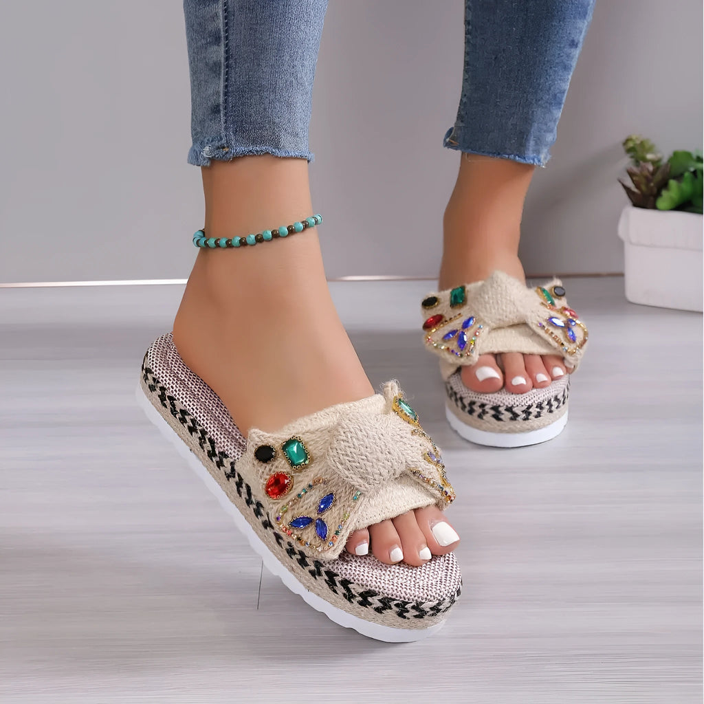 Women's beige platform sandals with bow detail, round toe and cloth upper, side view