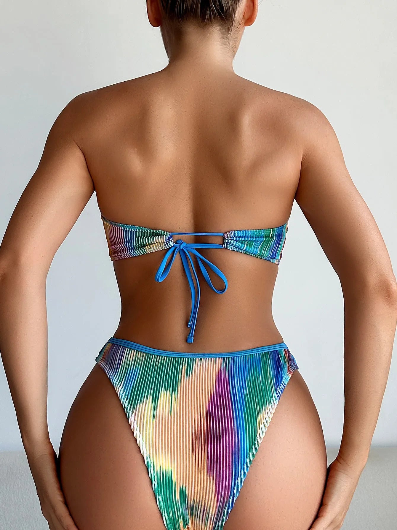 Colour printed polyester bikini set featuring a tube top and matching briefs for swimming.
