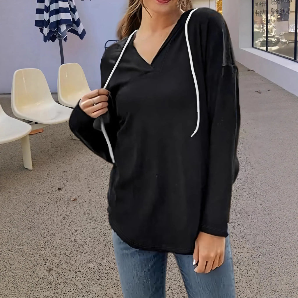 Women's red V-neck hooded sweatshirt with long sleeves in loose fit